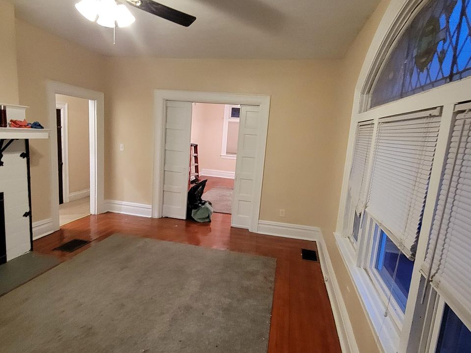 Livingroom and view into bedroom and hallway