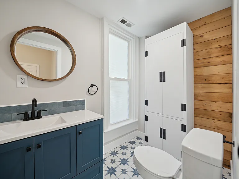 Half Bath with Tiled Floor and Feature Wall