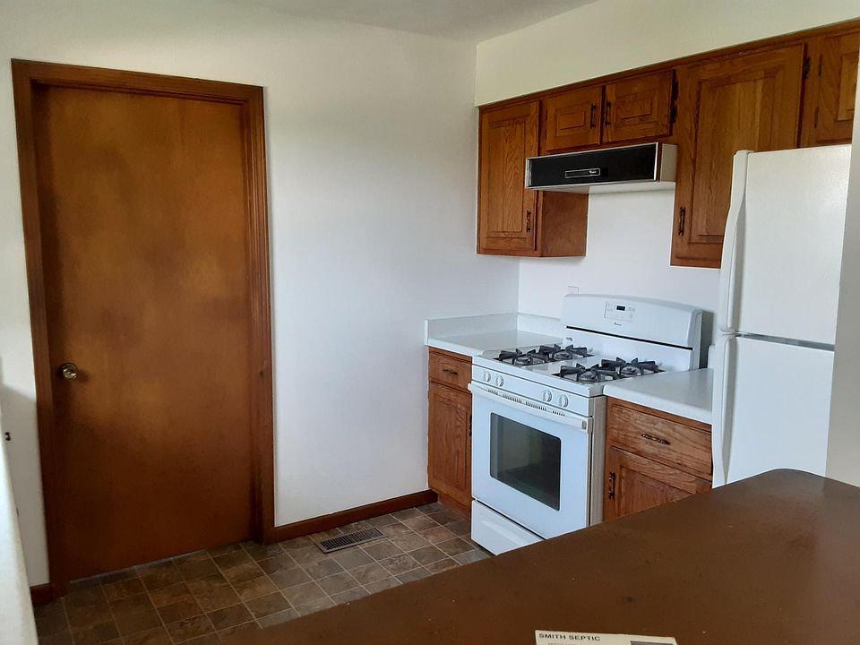 Kitchen with stove and refrigerator