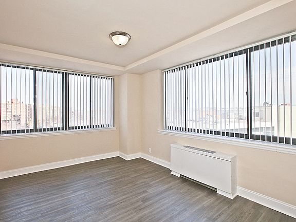 Spacious master bedroom with abundant windows