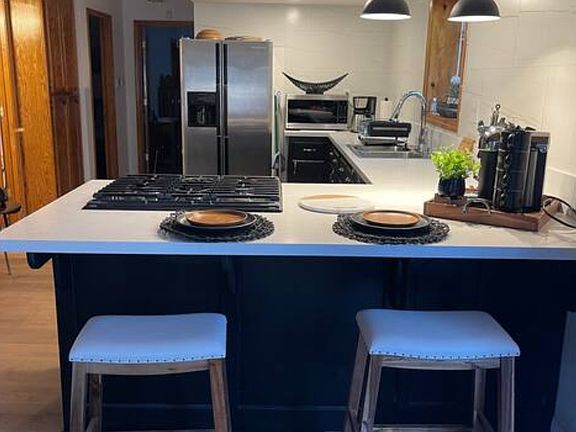Open concept kitchen with seating area.