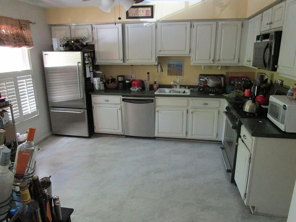 Spacious kitchen with stainless steel appliances.