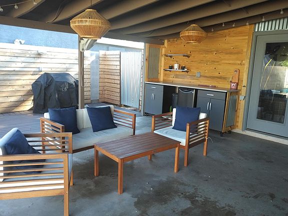 Covered patio with extended decking. Grill area is lighted and the bar counter is a perfect spot to lay out the food and drinks!