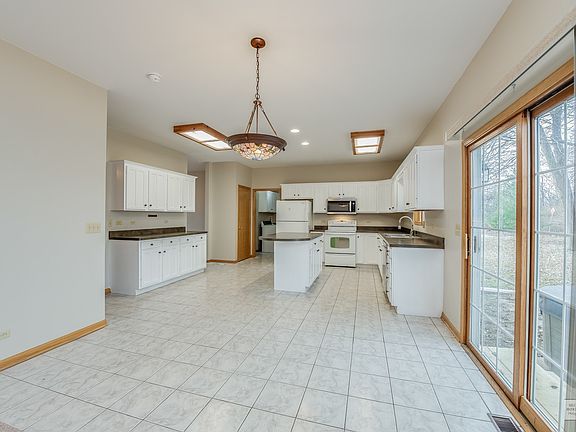 The breakfast area has plenty of room for a table and easy access to the back yard.