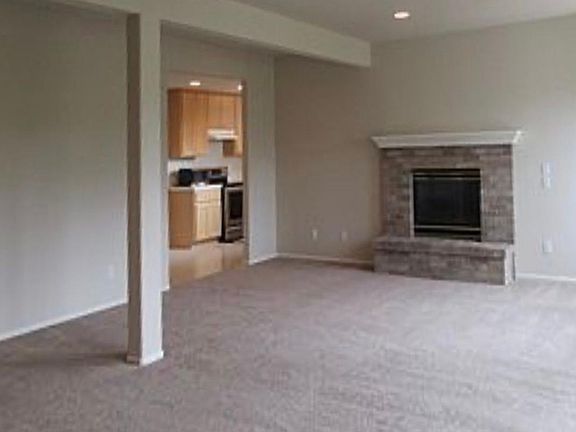 Main living room with attached kitchen