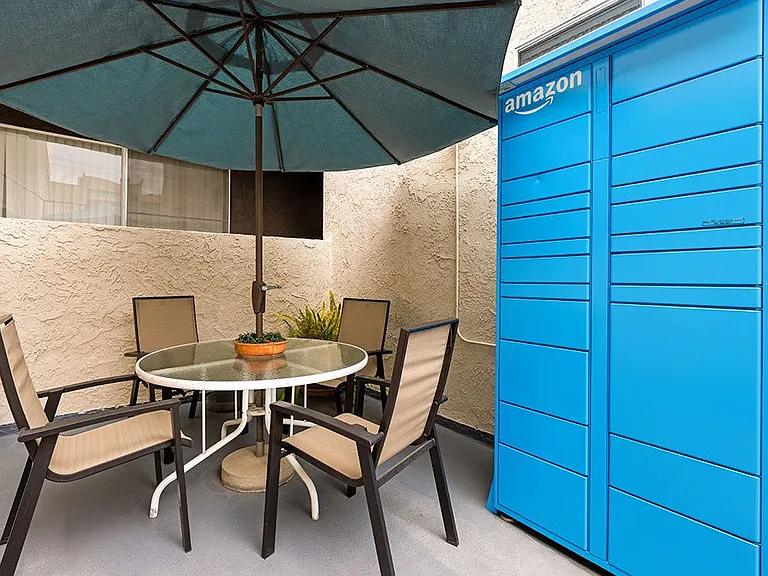 Amazon package delivery lockers and courtyard seating at 1249 South Bundy.