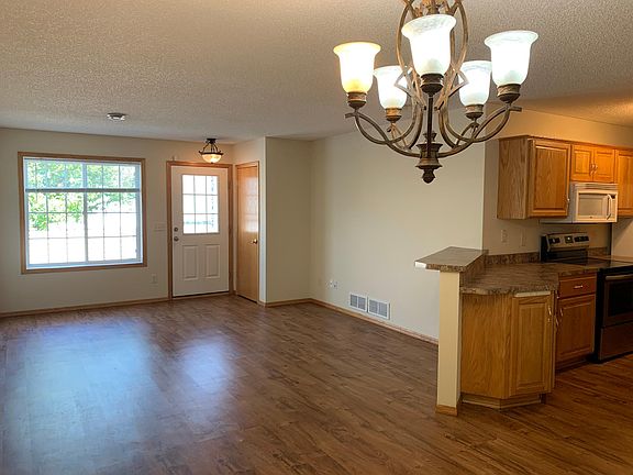The townhome has an open concept living room, dining room, and kitchen.