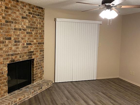 Slider located in the living room. The slider opens up to the side patio & secure storage area.