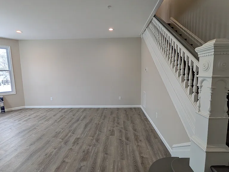 large and bright living and dining room with extra high ceilings