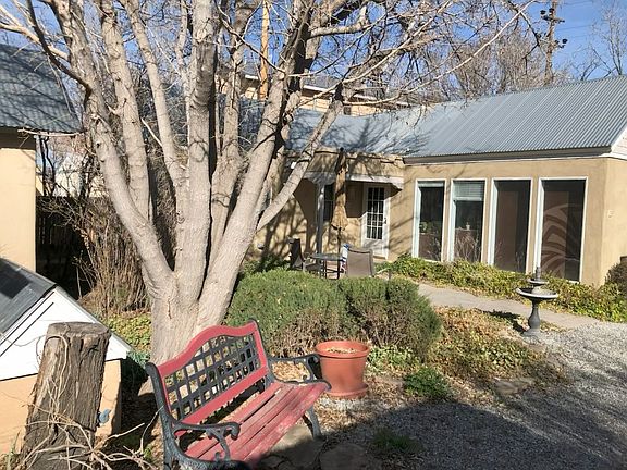 Front of unit and landscaped garden area.