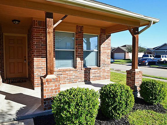 Fabulous front porch! Plenty of room for a swing or rocking chairs!