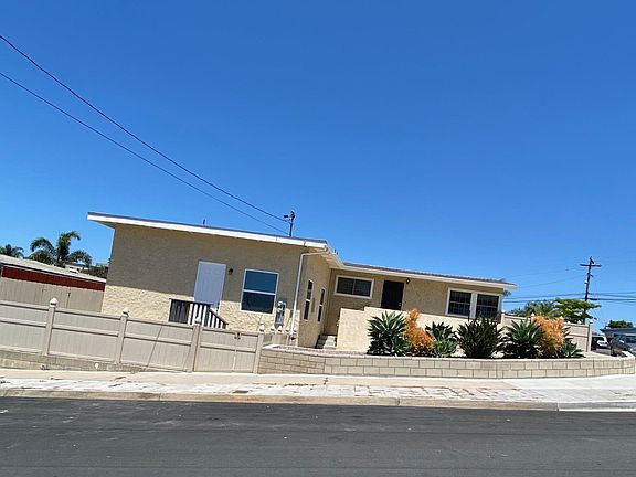 This is a photo of the entire property - Granny flat entrance is the white door on the left of this photo. Gate in vinyl fence at street for easy entrance. Driveway behind the plants is reserved for the granny flat tenant.