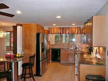 Beautiful kitchen has granite counters, all newer stainless Maytag appliance, ceramic tile floors, u