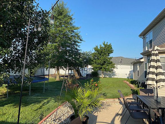 Back yard with vinyl fence