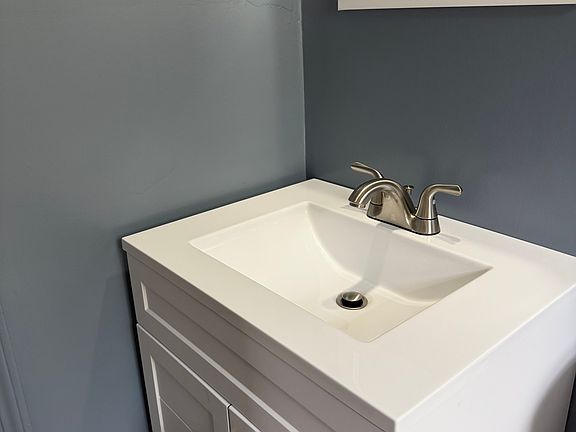 New vanity in full bath as well as floors and fixtures