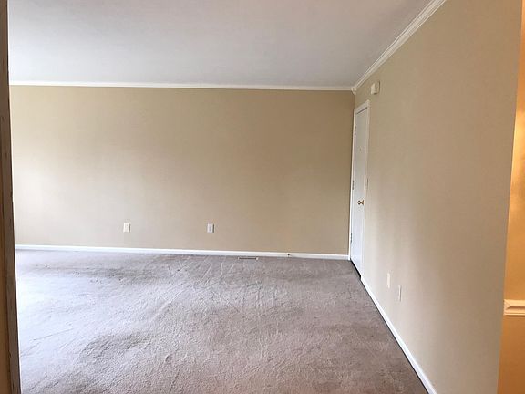 Look from kitchen to main room and unit entry.