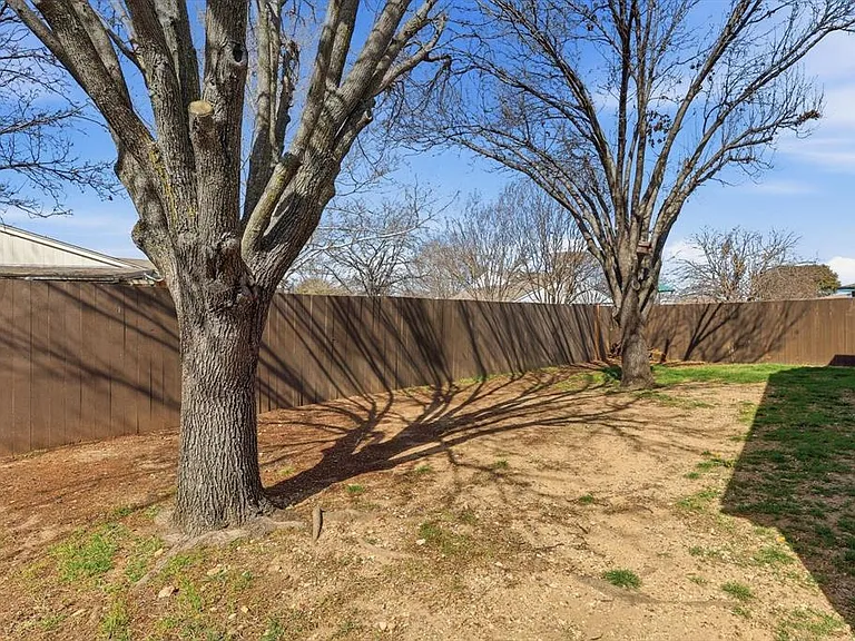 View of fenced backyard