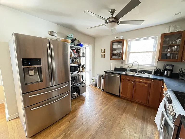 Kitchen. The door to the basement and the door to the rear deck are to the left, beyond the kitchen rack