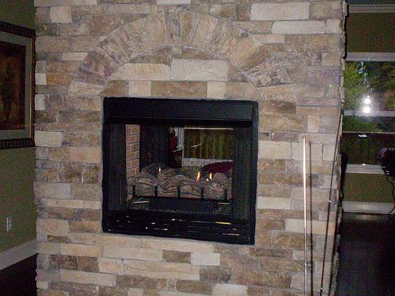 stack stone see through fireplace
