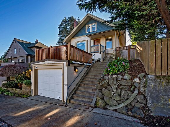 Private entrance to the lower unit is through the wooden gate.
