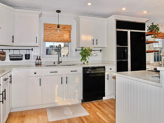 Beautiful, newly renovated, open-concept kitchen with commercial size refrigerator / freezer and 4 person breakfast bar. Kitchen is fully stocked with pots, pans, utensils, dishes, glassware, dishwasher, disposal, electric double oven, gas cook-top, coffe