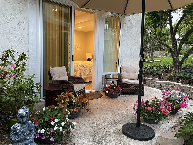 Entrance to your room at night. This is an end unit with access to lawn and fruit trees