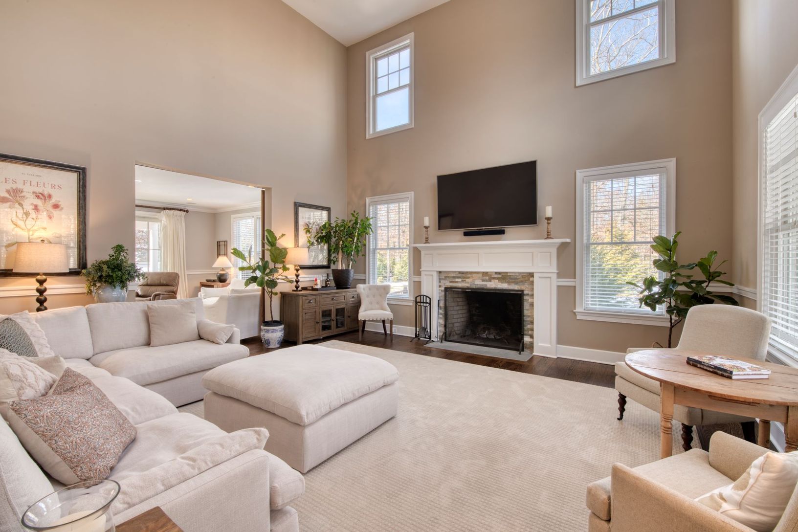 spacious living room with fireplace and large windows