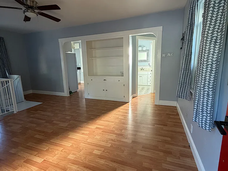 The sunny kitchen is to the left of the builtin.