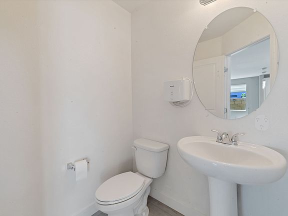 Prestine powder room downstairs.