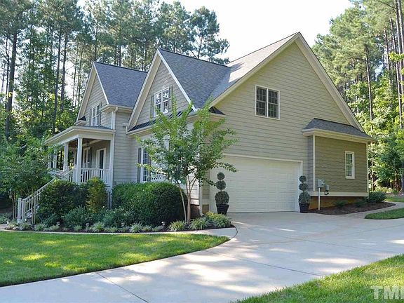 Side Entry Garage & a Paverstone Walkway that goes to the Deck & Back yard. The Finished Garage has an Epoxy Floor Coating & Shelving.