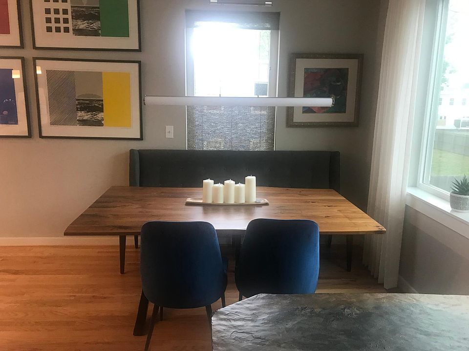 Dining area with lighting fixture.