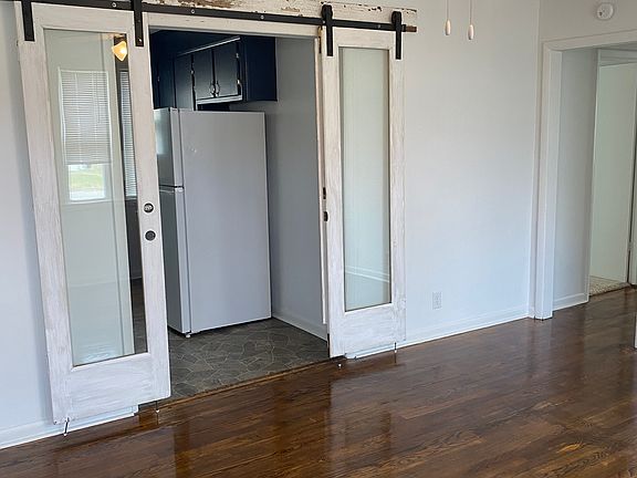 Fun Shabby Chic doors leading from family room into the kitchen.
