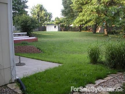 Back Yard : Patio is off family room, garden shed at rear of property