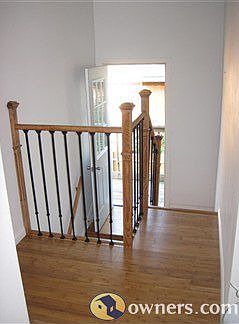 2nd floor loft view of mezanine deck and stair railing