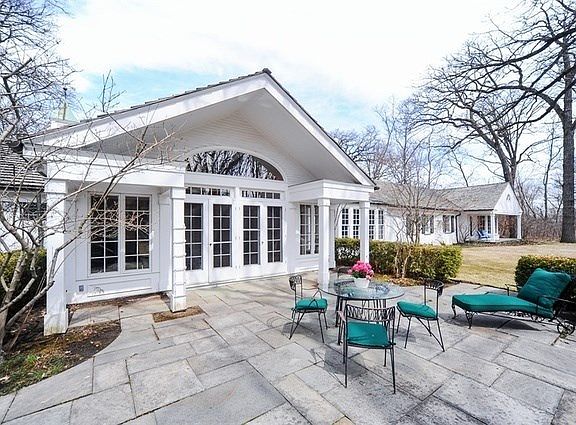 Symmetry and fabulous outdoor space and privacy are the signature features of this beautiful home on