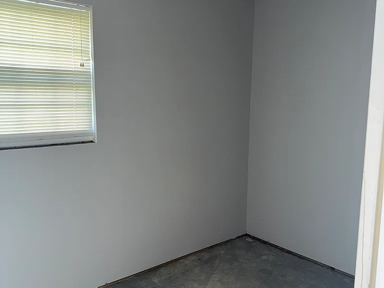Storage room off of carport