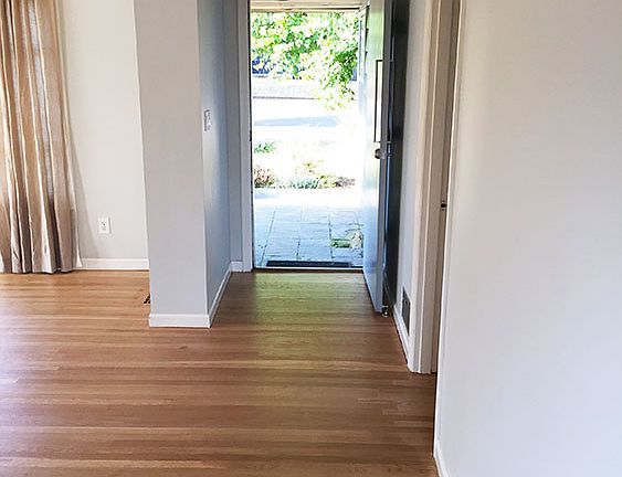 Entry inside the front door, opens to living room on left and bedrooms on right