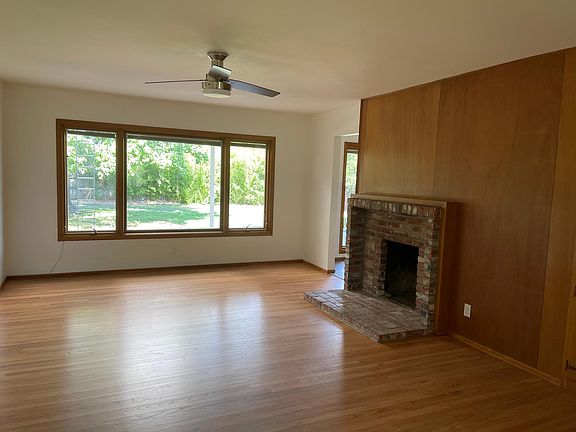 living room, refinished hardwood floors, new ceiling fan