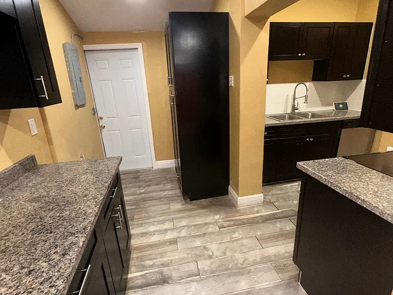 Kitchen includes a spacious pantry with ample storage for groceries, small appliances, and everyday essentials.