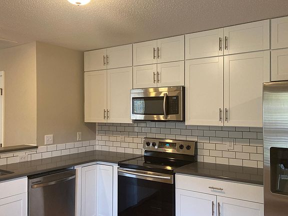 Updated kitchen with new appliances.