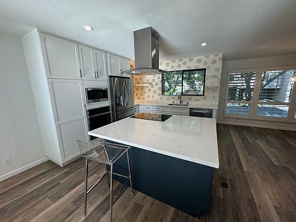 Newer kitchen cabinets countertops and appliances.