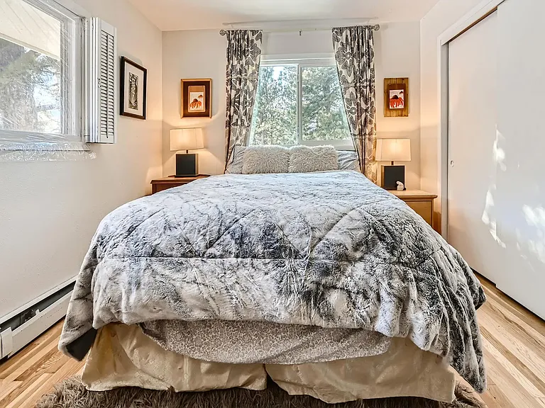 Second upper bedroom new queen bed and mattress with fine art decor, large closet and new windows, looks over the garden and into the forest with mountain views.
