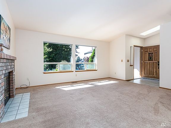 Nice solid wood door with cute stain glass window and light from the skylight welcome you at the front door. Coat closet just a step down the hall.