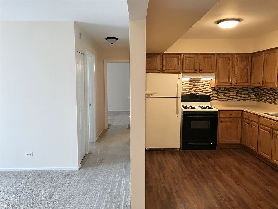 4. Kitchen & Long Hall Leading To Bedrooms