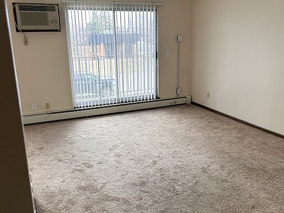 The living room offers a large space and south facing views overlooking the private balcony.