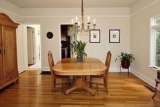 Formal dining room with glowing hardwood floors