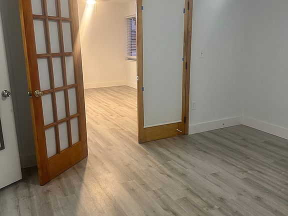 French doors open to bedroom