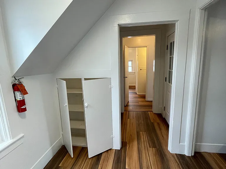 view from kitchen down hallway towards bedroom and bathroom