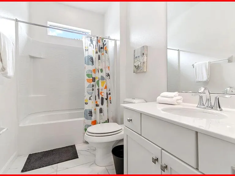 The bedroom connects directly to a full private bathroom for added convenience.