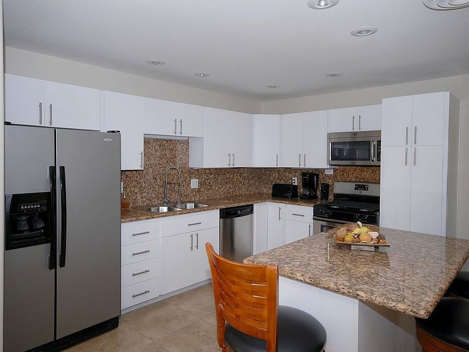 Kitchen with Solid Granite and stainless steel appliance package